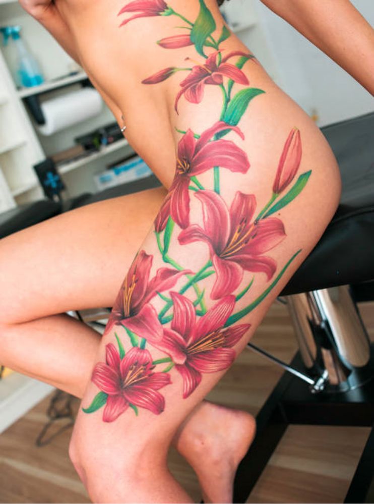 Lily tattoo down leg